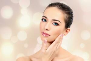 portrait of pretty woman with clean skin against light background photo