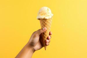 Male hand holding vanilla ice cream in waffle cone on yellow background. High quality photo for design an advertising, banner, website. AI Generative