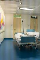 An ambulatory bed with comfortable medical equipment in a modern hospital. Free beds with convenient medical equipment. photo