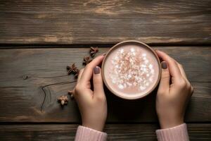 Top view of female hands holding a cup of hot cocoa on rustic wooden table with copy space. Generative Ai photo