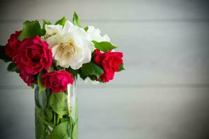 bouquet of beautiful white and red on table photo