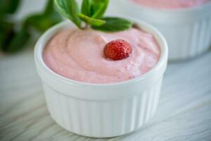 sweet curd mass whipped with fresh strawberries in a bowl photo