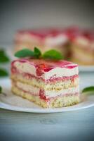 strawberry poppy cake with cream in a plate photo