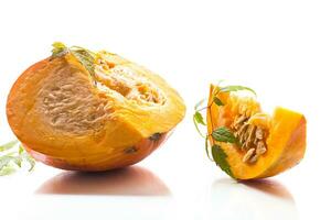 A piece of ripe orange pumpkin with seeds on a white background. photo