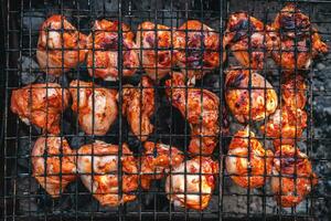 golden brown grilled chicken meat is cooked on the grill outdoors photo