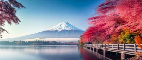 Mount Fuji in Japan Kawaguchiko lake autumn red leaves on trees mountain covered in snow calm lake reflects mountain and trees. AI generative photo