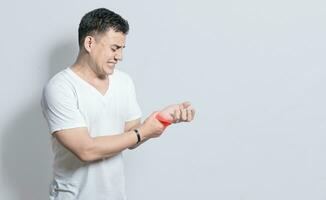 People with wrist pain isolated, concept of man with pain in the hands, man with arthritis rubbing, person with pain in the wrist, Concept of arthritis in the wrist photo