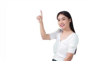 Asian girl with black long hair wears white shirt smile and point her hand to present something on the white background. photo