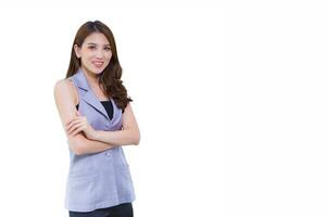 Professional young Asian woman office worker in gray shirt with arm crossed at work happily smiling working confidently and happily while isolated on white background. photo