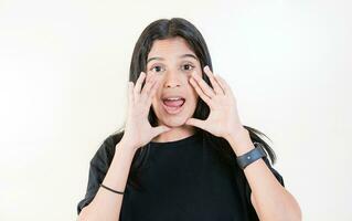 Young girl announcing something to the camera. Young woman screaming and announcing at the camera photo