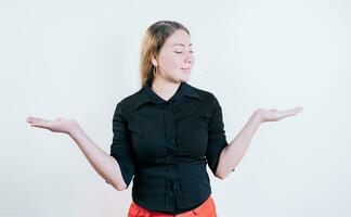 Smiling woman comparing with palms with hands isolated. Girl balancing something with palms isolated photo