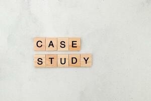 Top view of Case Study word on wooden cube letter block on white background. Business concept photo