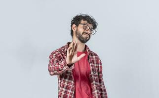 man rejecting with one hand, a man with rejection expression, isolated man with hand rejecting photo