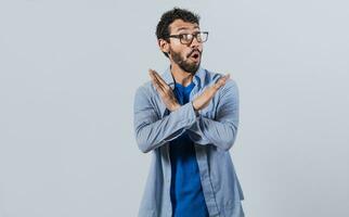 Man crossing arms in rejection, a man crossing his arms with rejection expression, concept of man rejecting photo
