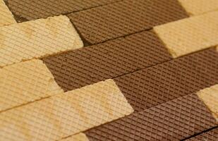 Stacked delicious chocolate wafers in large amount. Two different flavours of classic waffles photo