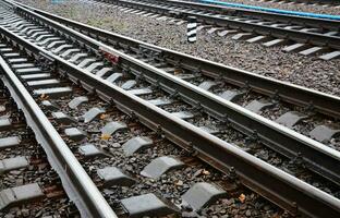 Photo fragment of the railroad tracks in the rainy weather