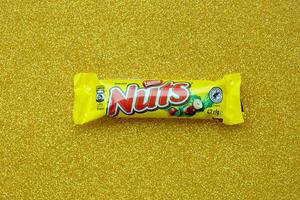 KYIV, UKRAINE - MAY 4, 2022 Nuts original chocolate bar manufactured by Nestle company photo