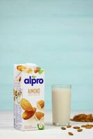 KHARKIV, UKRAINE - JANUARY 2, 2021 Alpro almond vegetarian milk pack produced by European company based in Wevelgem photo