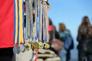 CARPATHIAN MOUNTAINS, UKRAINE - OCTOBER 8, 2022 Trade of medals on the top of Hoverla mountain in Carpathians photo