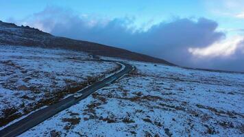 White Car on Road in Summit Lake Park in Mount Evans Area in Winter. Aerial View. Colorado, USA. Drone Flies Forward video