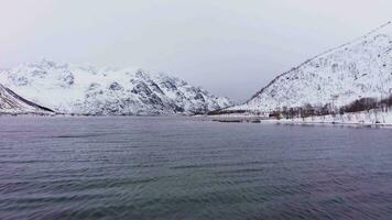 Laupstadosen Fjord and Mountains in Winter. Lofoten Islands, Norway. Aerial View. Drone Flies Forward at Low Level video