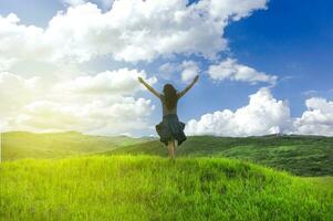 woman in the field spreading her hands, concept of woman in the field in freedom photo