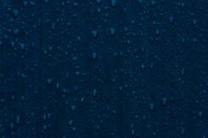 Water drop on a wooden table background, Rain Drops on Blue Wood Wall or Floor photo