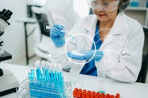 Dctor work on digital tablet healthcare doctor technology tablet using computer in laboratory study with virtual icon photo
