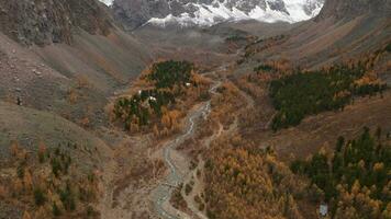 Mount Karatash in Aktru Valley in Autumn. The Altai Mountains. Russia. Aerial View. Reveal Shot video