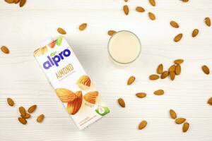 KHARKIV, UKRAINE - JANUARY 2, 2021 Alpro almond vegetarian milk pack produced by European company based in Wevelgem photo