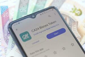 TERNOPIL, UKRAINE - AUGUST 3, 2023 Credit Agricole application on screen on modern smartphone. Official app of famous polish bank photo