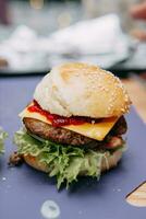 Burgers with beef and vegetables. Close up. Delicious burgers in a cooking class. Burger with lingonberry sauce. photo