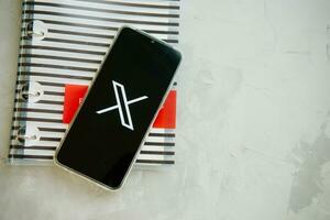 July 25, 2023, Russia. The logo in the form of the letter X displayed on the smartphone. Twitter rebranding, and implementation of X. photo