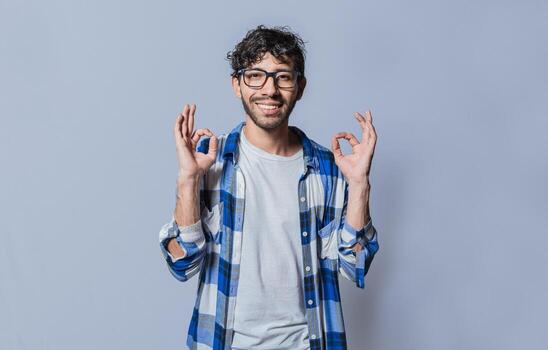 Smiling person gesturing OK in sign language, Interpreter man gesturing OK in sign language. Young man gesturing OK in sign language isolated. Manual gestures of people with hearing problems photo