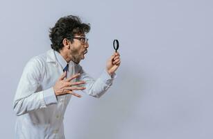 Scientist holding a magnifying glass looking to the side, Man in a white coat with a magnifying glass looking advertisement, Surprised scientist observing with a magnifying glass to the side photo