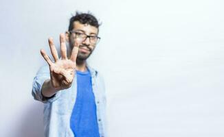 Portrait of people counting number four on isolated background. Person hand counting number four. Handsome guy hand showing number four photo