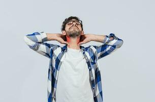 Young man with shoulder and neck problems, Person in pain rubbing his neck isolated, Concept of people with stress and neck pain problems. Tired guy with neck pain isolated photo