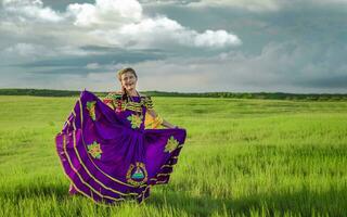 Young Nicaraguan woman in traditional folk costume in the field, Portrait of Nicaraguan girl in traditional folk costume in the field photo