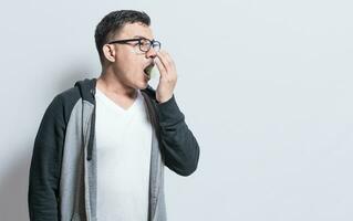Handsome man with bad breath and halitosis problem, People with bad breath problem, Concept of person with halitosis and bad breath photo