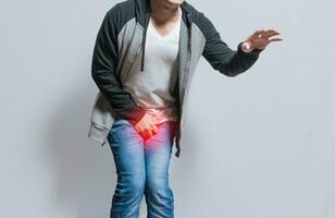 Urinary incontinence Medical problem. people with crotch pain, man with urinary problems, Man with hands on crotch with urinary problems photo