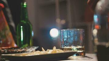 food and drink male friends are happy drinking beer and clinking glasses at a bar or pub. video