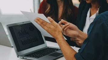 Business team meeting present, investor colleagues consultation and conference new strategy plan business and market growth on financial document graph report, Meeting and Talking. video