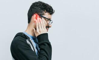 Concept of person with otitis and tinnitus, Person with ear pain, on isolated background, Suffering man massaging his ear isolated photo