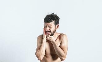 Person with earache on isolated background, man with earache on isolated background, ear disease concept photo