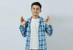 Interpreter man gesturing OK in sign language. Guy gesturing OK in sign language isolated. Manual gestures of people with hearing problems. Smiling person gesturing OK in sign language photo