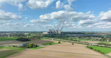 Drone movie of a coal-fired power station with smoking chimneys video