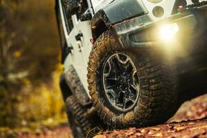Four Wheel Drive Vehicle Off Road Tires Close Up photo