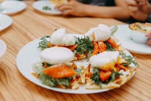 Viennese waffles with greens, salmon and poached egg, Breakfast at the cooking class. Delicious and healthy Breakfast. photo