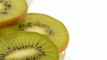 Slices of kiwi rotating.Loop video