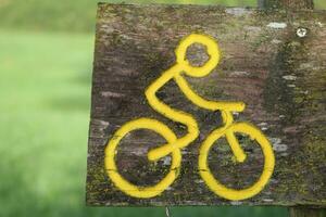 Bicycle bike trail path sign, tourist hiking trail, black trail, green path, bike path photo